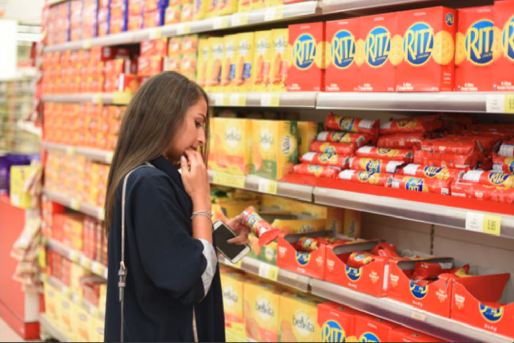 Woman shopping for Mondelez products