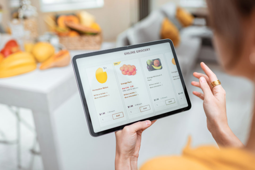 Woman shopping for groceries online via tablet