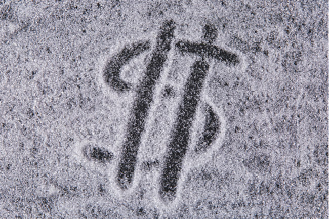 Money symbol drawn in sugar