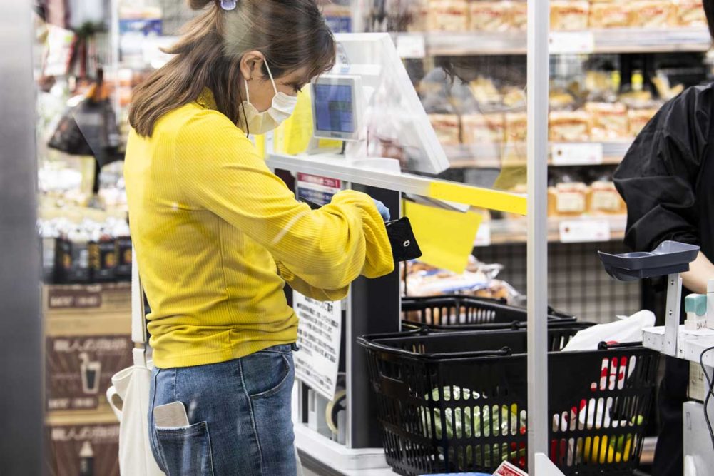 Women paying for groceries