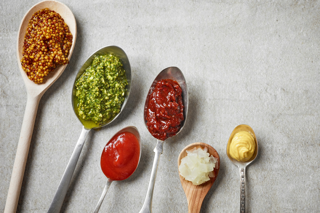 Assorted sauces on spoons