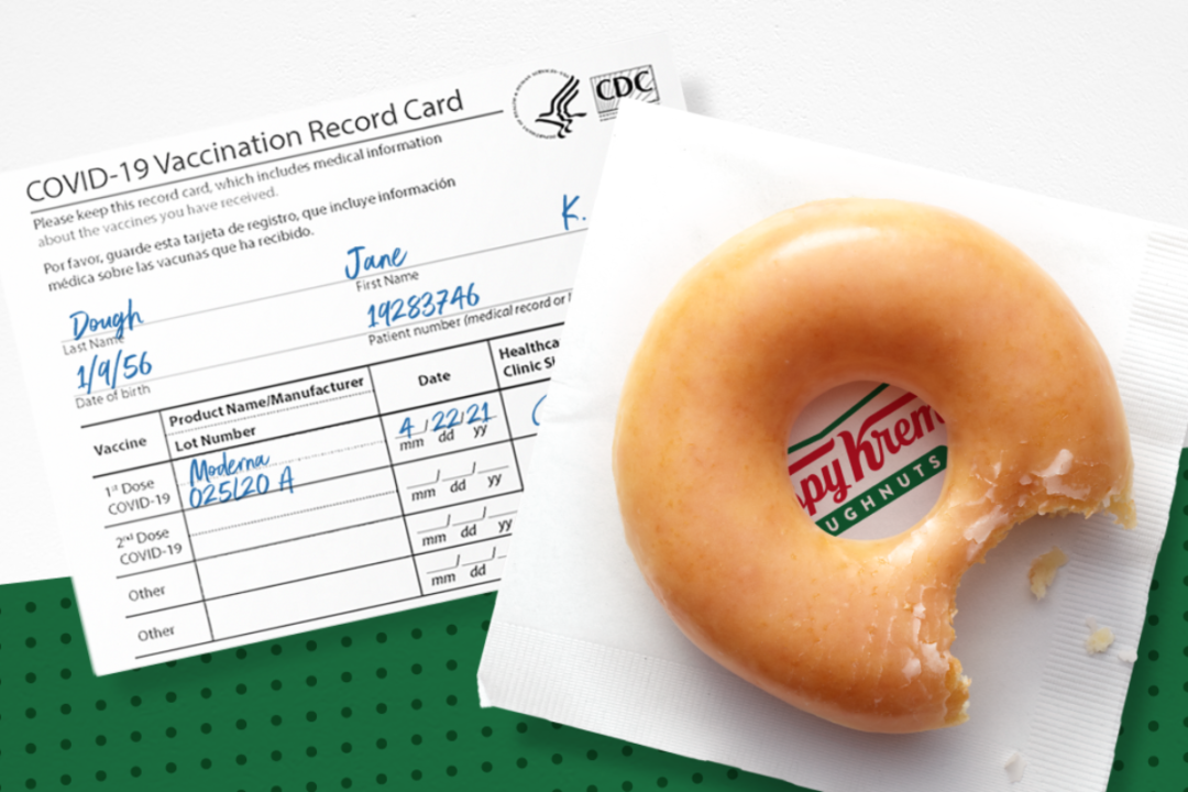 Krispy Kreme Doughnuts on top of vaccine certification document