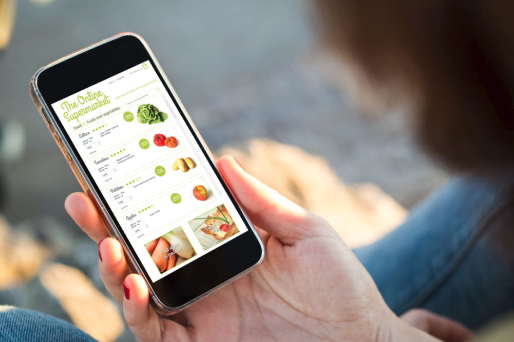 Shopping for groceries online using a mobile phone.