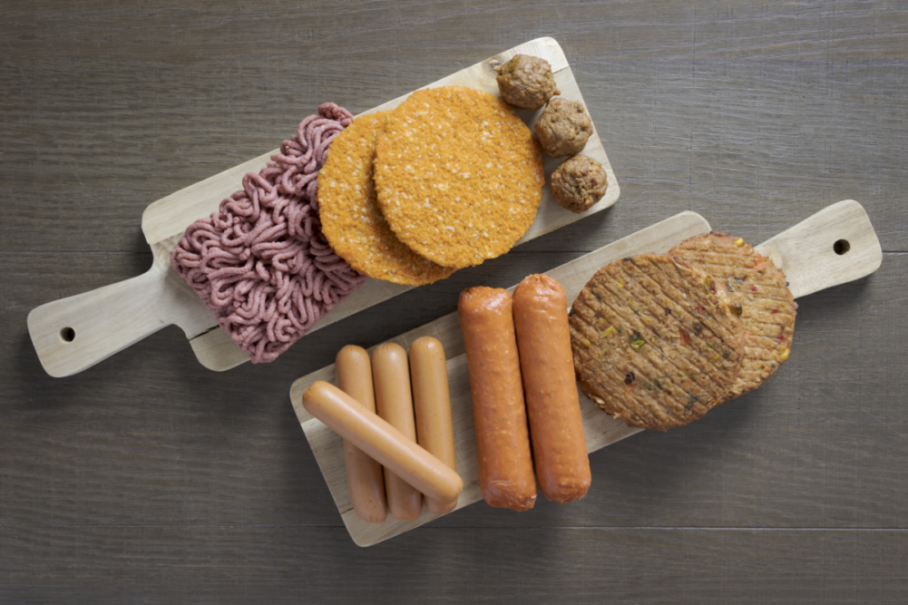 Flat lay of plant based vegetarian meat products. burgers sausage.