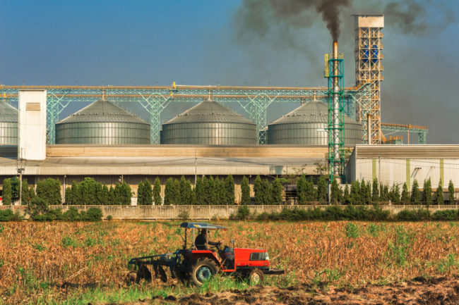 Agricultural silos with thick smoke from pipe emissions