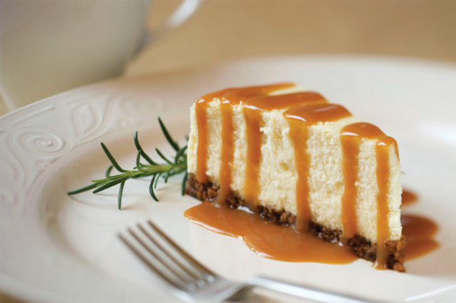 Slice of cheesecake with caramel sauce. 