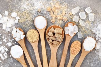 Types of sugar in wooden spoons