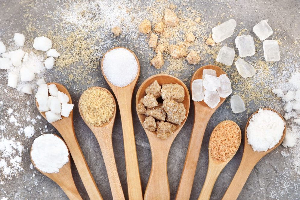 Types of sugar in wooden spoons