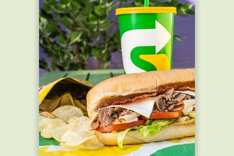 Subway sandwich, chips and drink