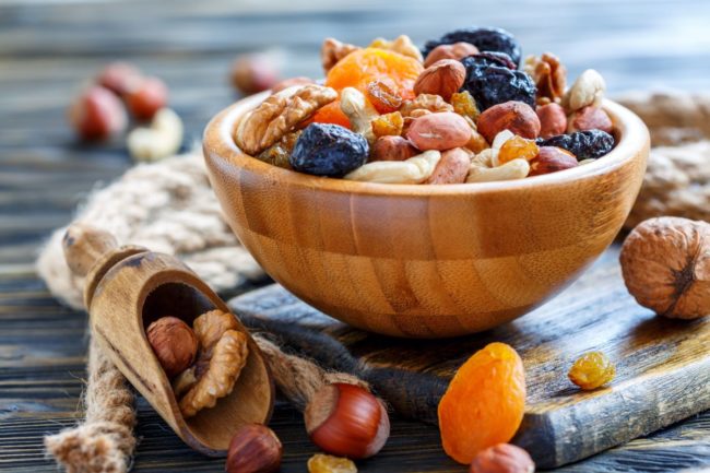 Dried nuts and fruits, wood bowl, mixed nuts