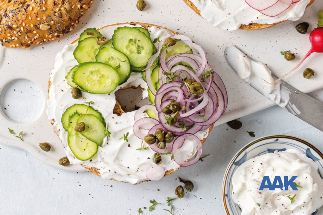 Bagel and cream cheese, cucumbers, onions