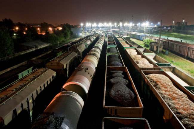 Train cars, commodities, night time, Adobe Stock