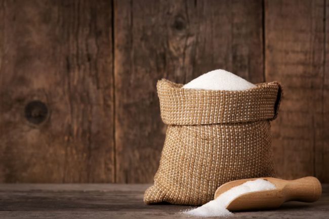 Burlap sugar bag, wood sugar scoop, Adobe Stock