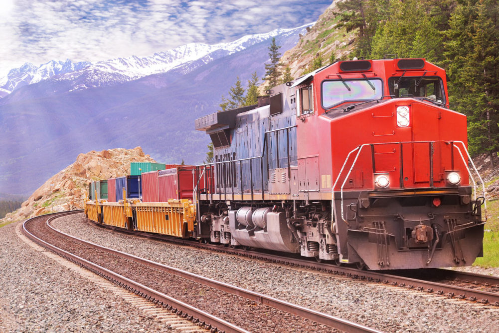 Freight train, mountains, Adobe Stock