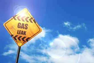 Gas leak sign, blue sky