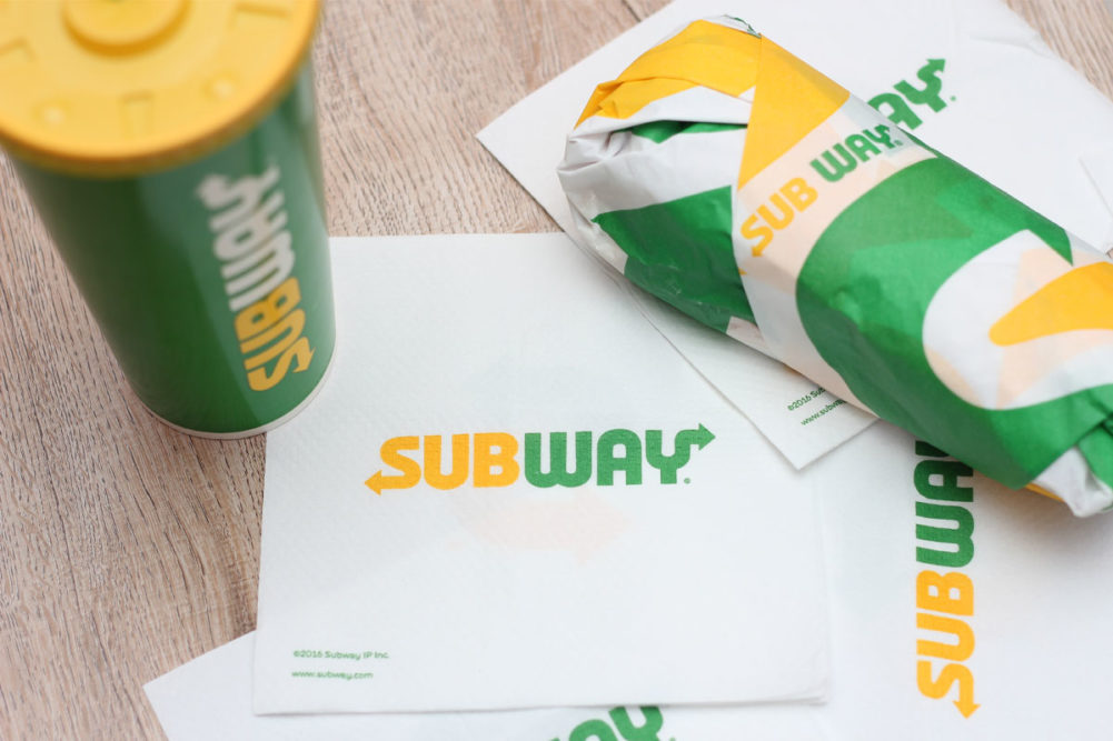 Subway napkins, sandwich and drink