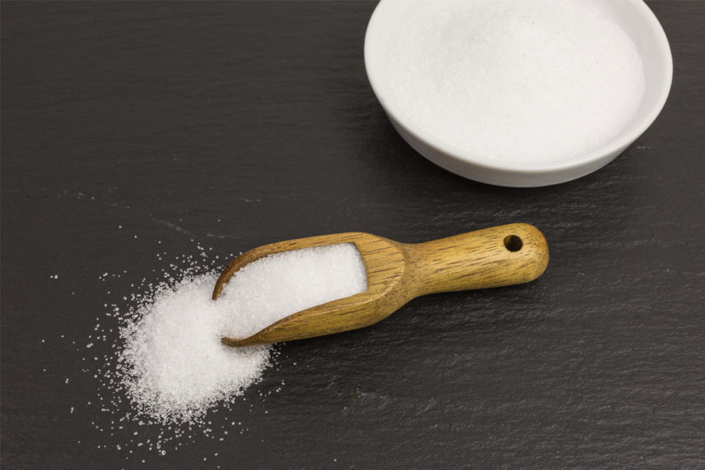 Erythritol in a wooden scoop