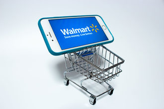 Walmart website on smart phone, small grocery cart