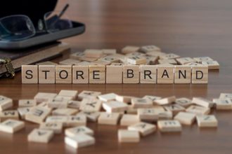 Scrabble tiles spelling out "Store Brand"