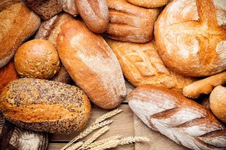 Pile of bread products on wood background