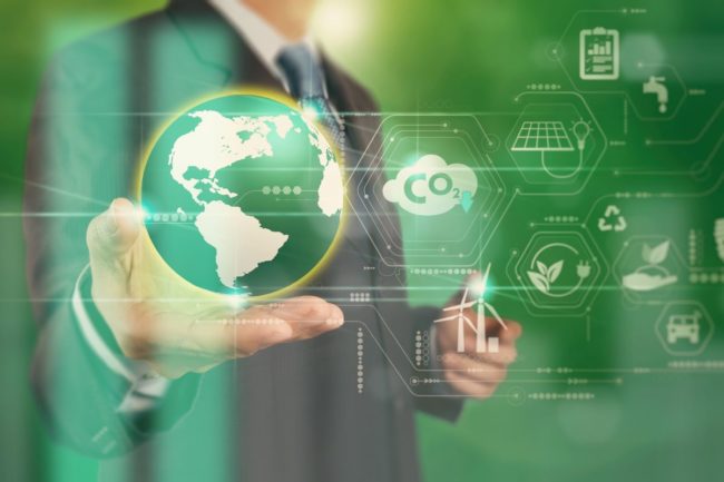 Sustainability graphic, man in a suit, holding globe holograph, green background