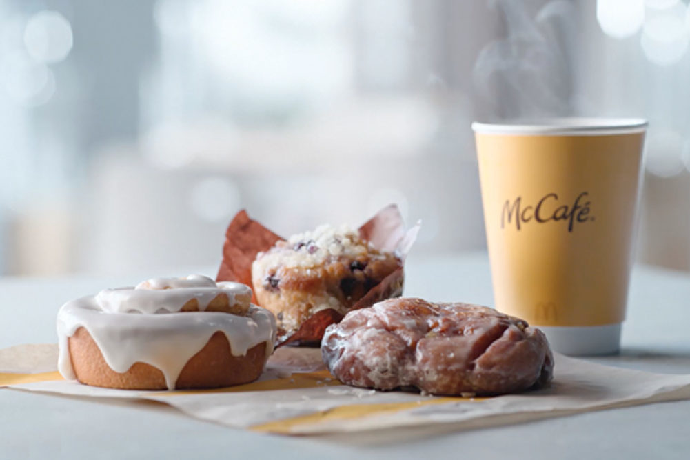 Assortment of McCafe bakery items including coffee and a muffin