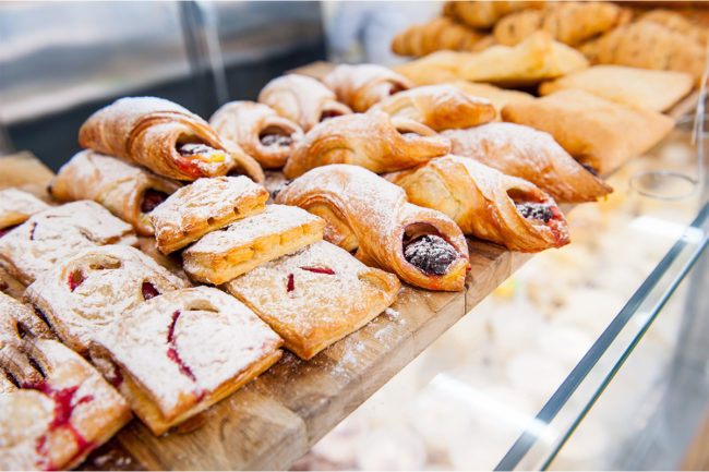 Assortment of varied pastries with powdered sugar. 