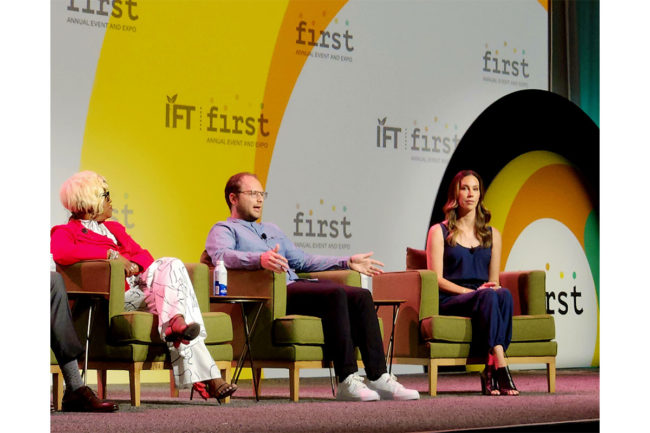 3 consumers sit on the IFT stage at a panel. 