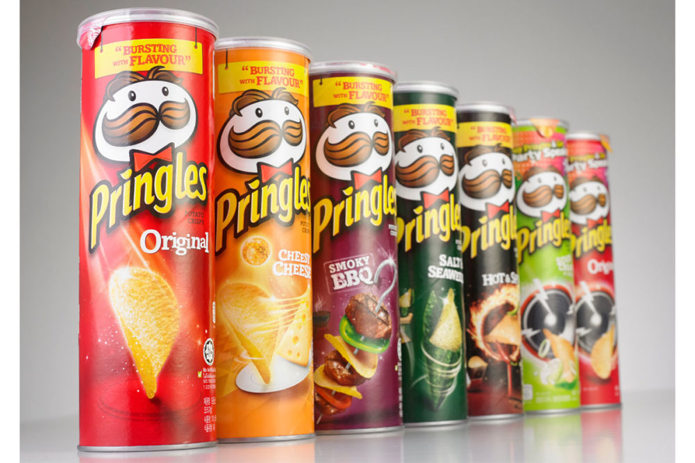 Assortment of Pringles cans and flavors. 