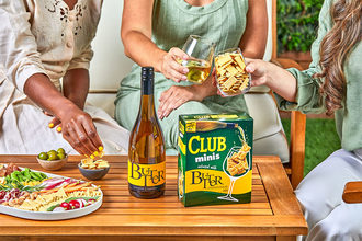 A group of women drink chardonnay and eat Club Crackers. 