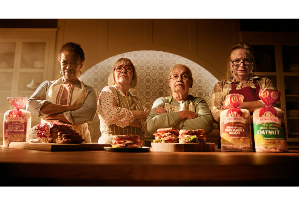 Four grandmas pose in front of their delicious sandwiches made with Bimbo Bakeries bread. 