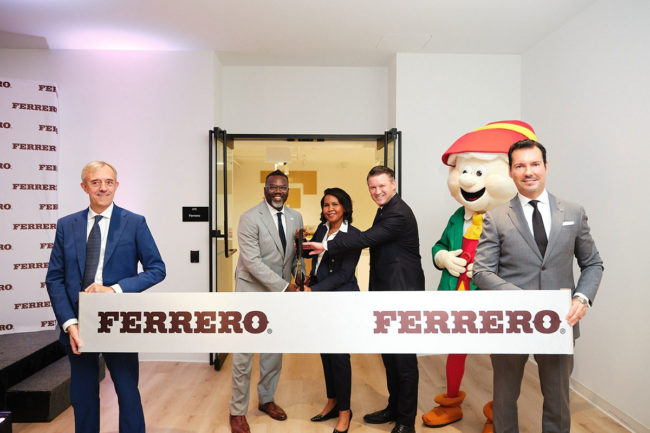 Employees at Ferrero cut ribbon for grand opening. 