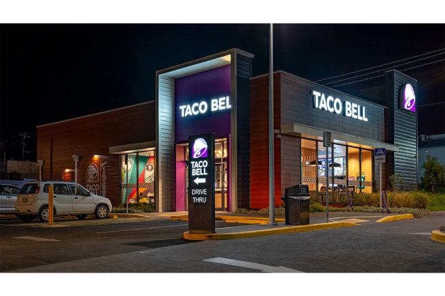 A Taco Bell restaurant at night. 
