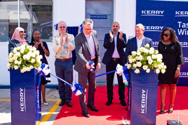 Kerry employees cut ribbon at Tanzania facility. 