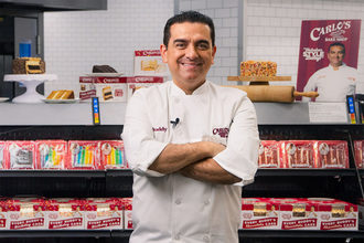 Buddy "The Cake Boss" Valastro in front of a Walmart display. 