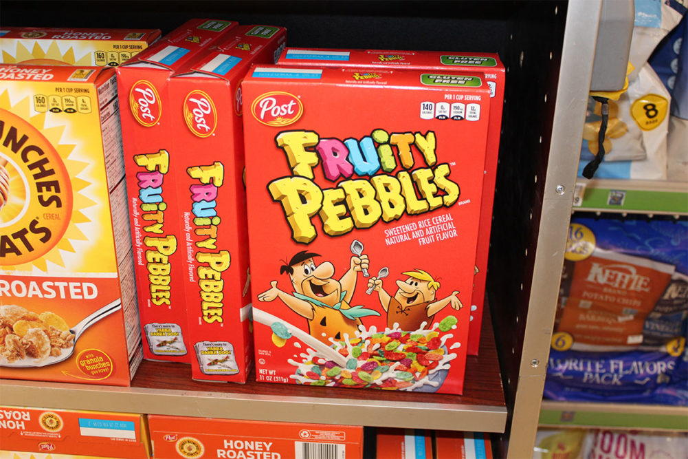 A box of Fruity Pebbles cereal. 