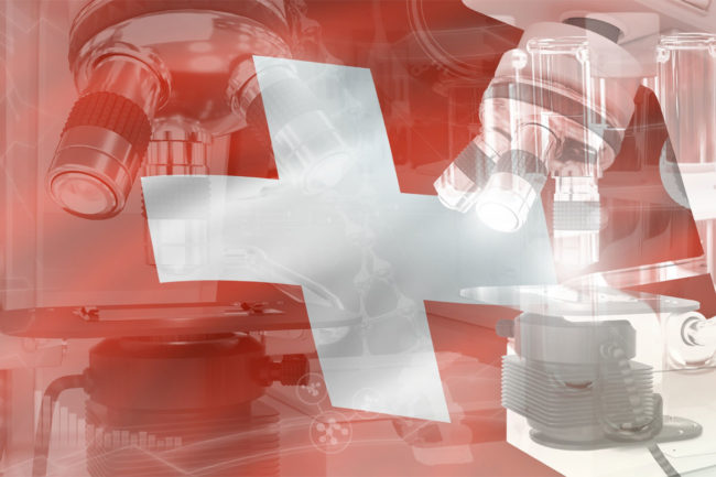 Swiss flag layered over microscope.