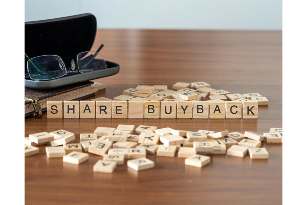 "Share buyback" spelled out on Scrabble tiles. 