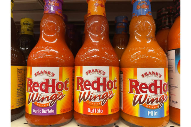 Frank's Red-Hot sauce on a grocery store shelf. 