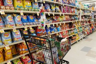 Assortment of chips and salty snacks in the grocery store.