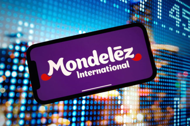 Mondelez Logo on phone with purple background. 