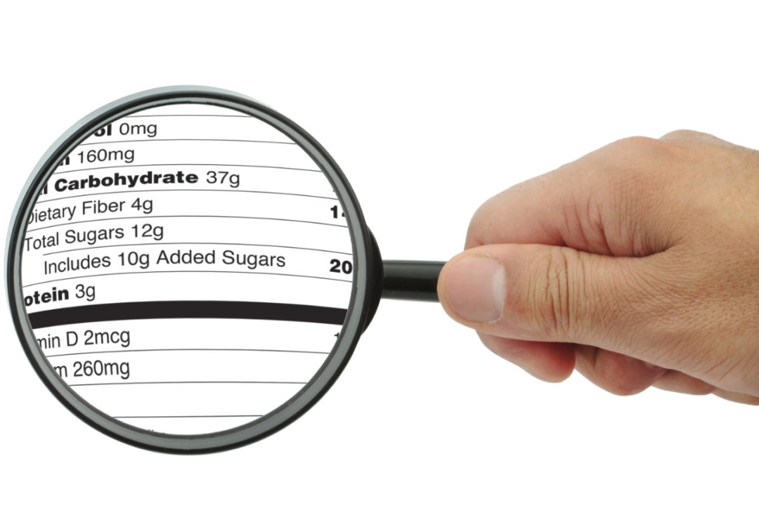 Added sugars label under magnifying glass